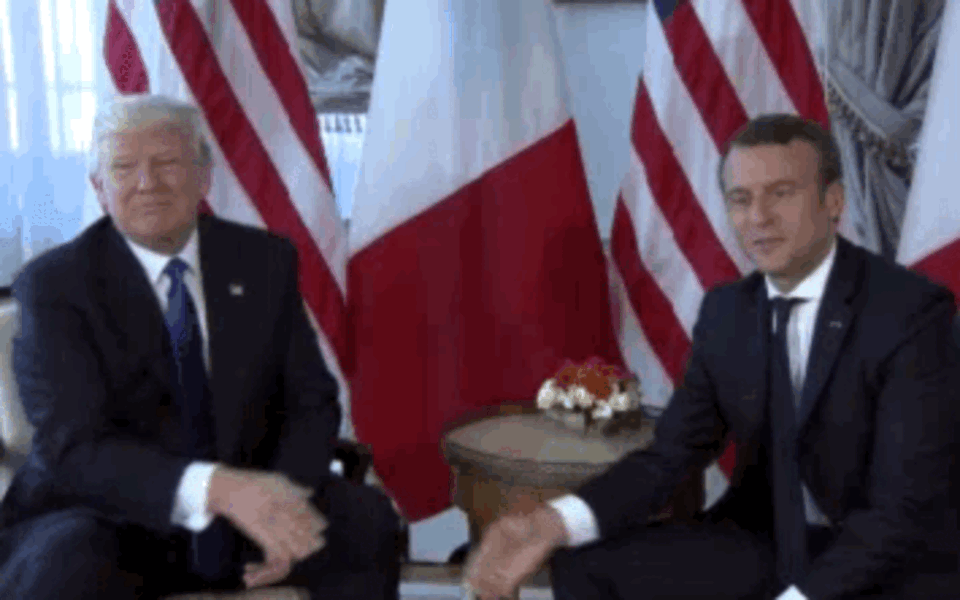 Donald Trump and Emmanuel Macron just exchanged a white-knuc.gif